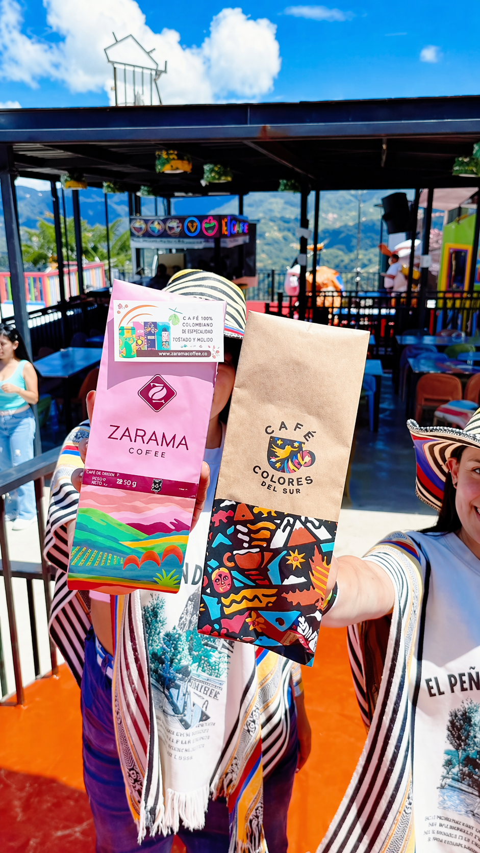 Bolsso team at coffee expo holding Zarama and Colores del Sur bags